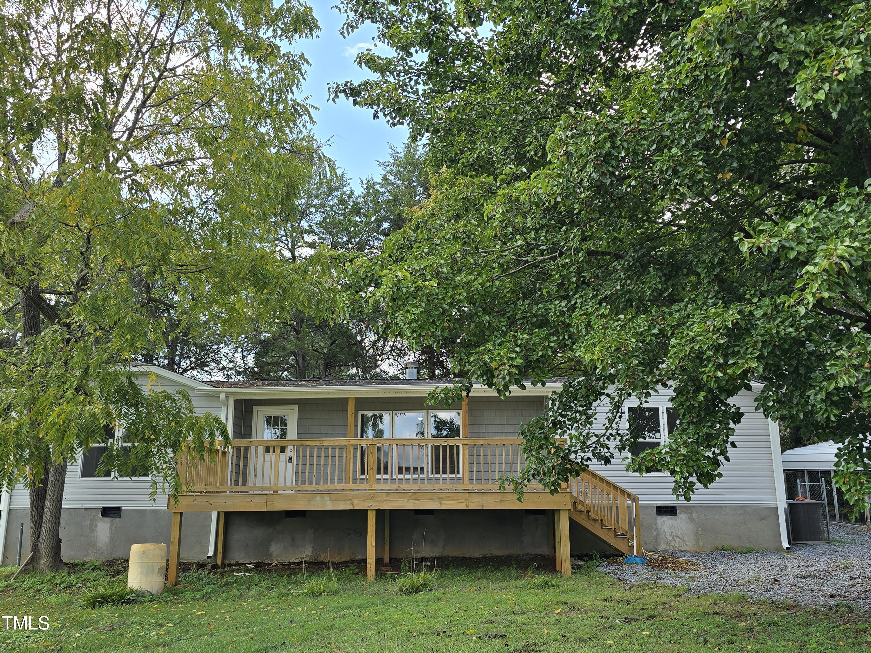 a view of a house with a house in the background