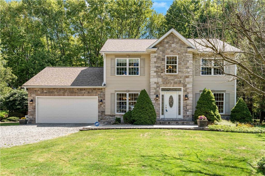 a front view of a house with a yard