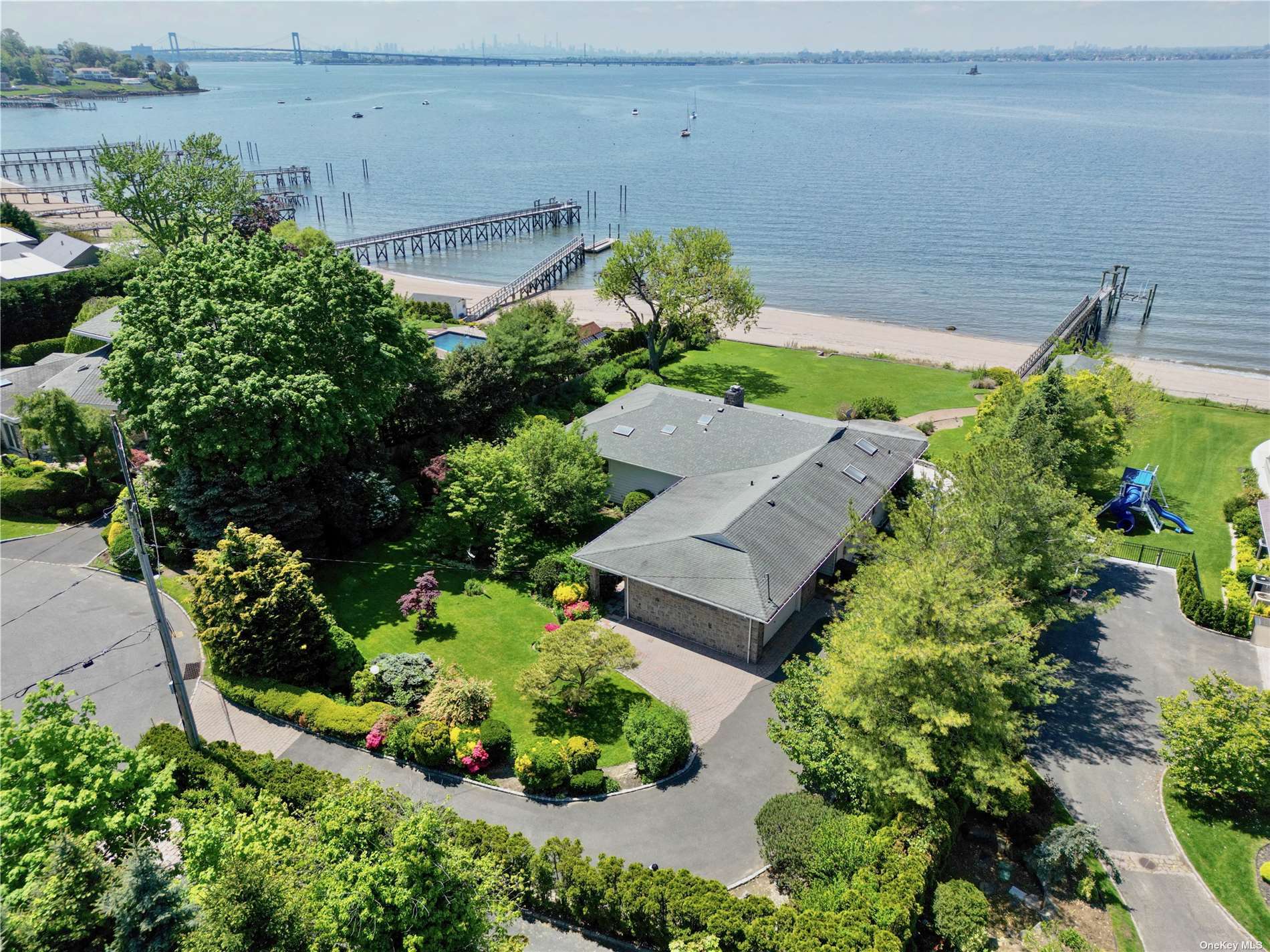 an aerial view of a house with a yard and a garden