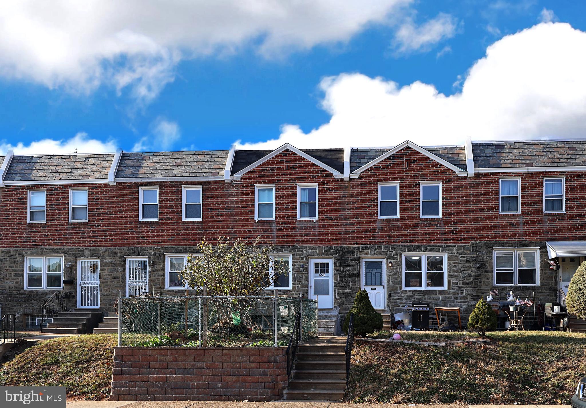 a front view of a house with yard