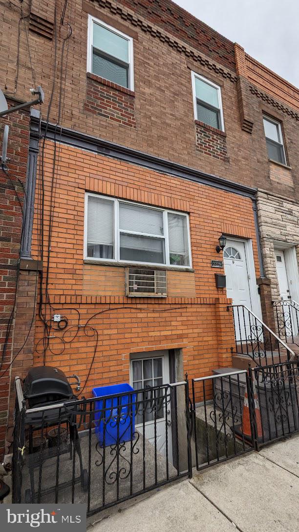 a red brick building with table and chairs