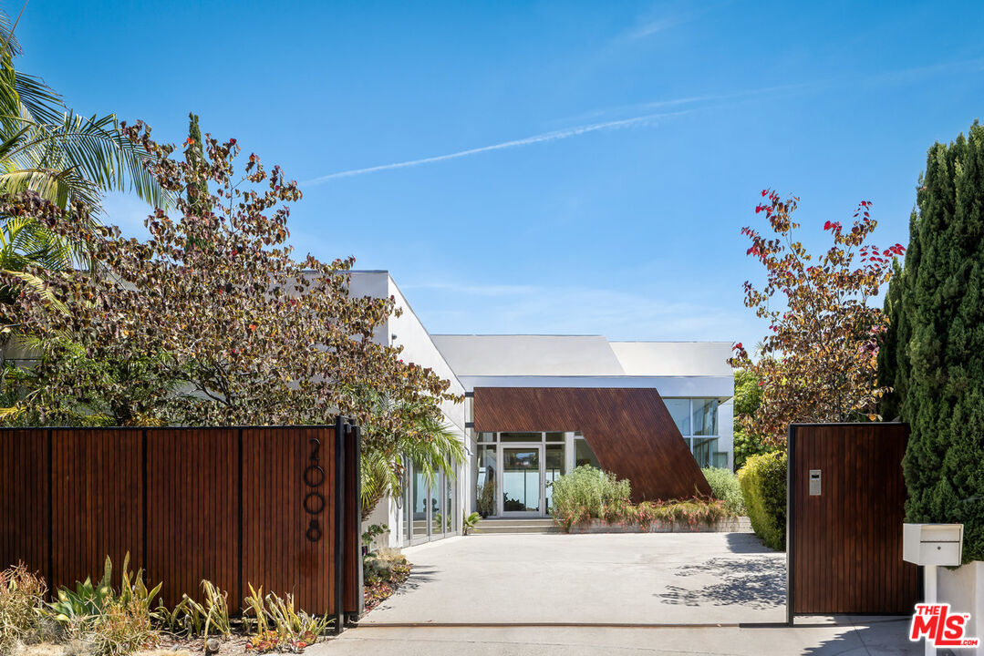 a view of a house with a flower garden