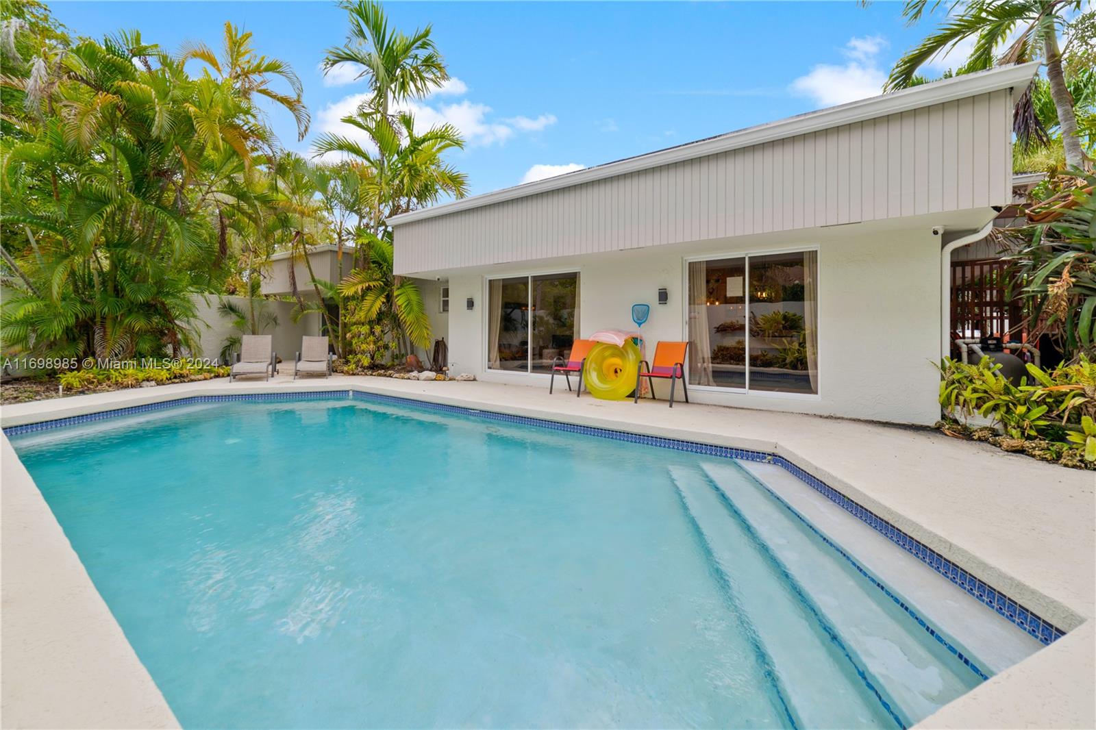 swimming pool with outdoor seating