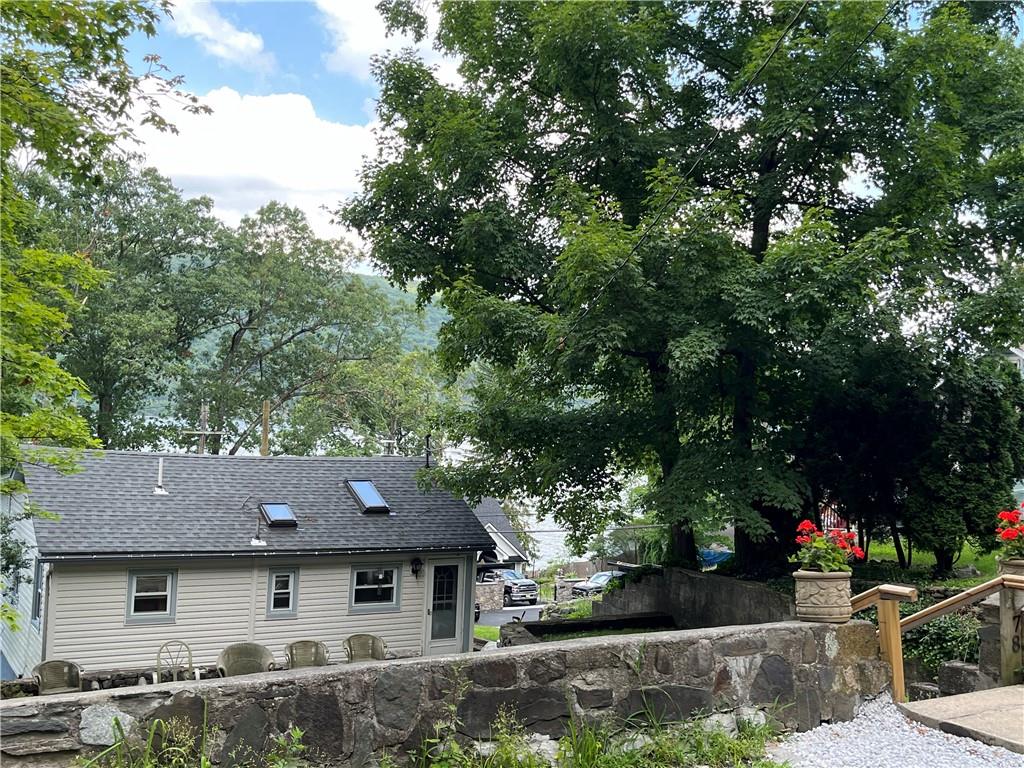 a front view of a house with trees