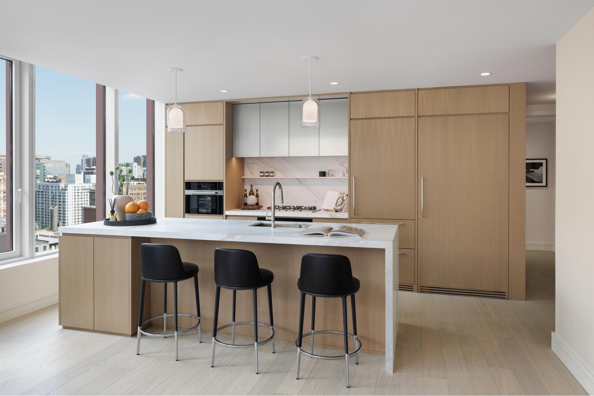 a kitchen with a sink and chairs