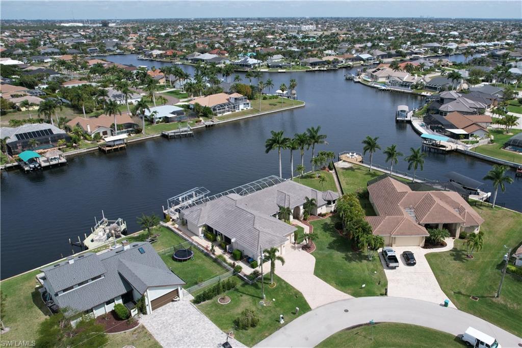 an aerial view of a house with a lake view