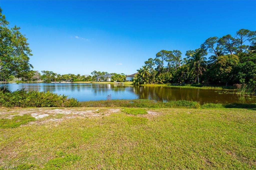 a view of a lake with houses in the back