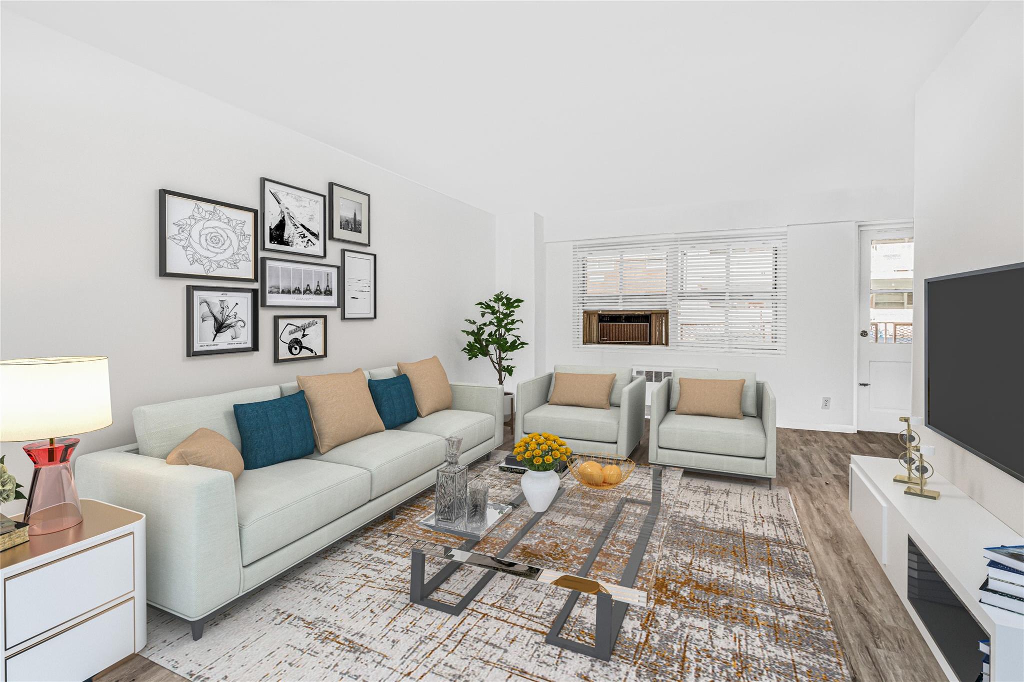 a living room with furniture and wooden floor