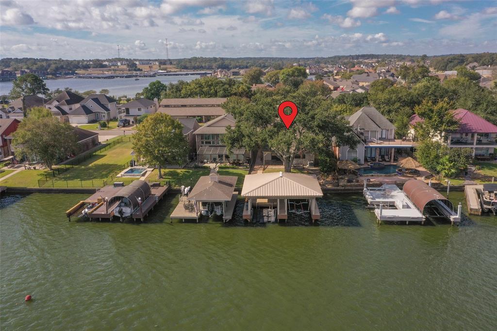 a aerial view of a house with swimming pool and outdoor seating