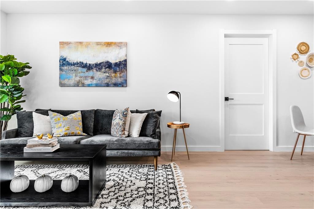 a living room with furniture and a rug