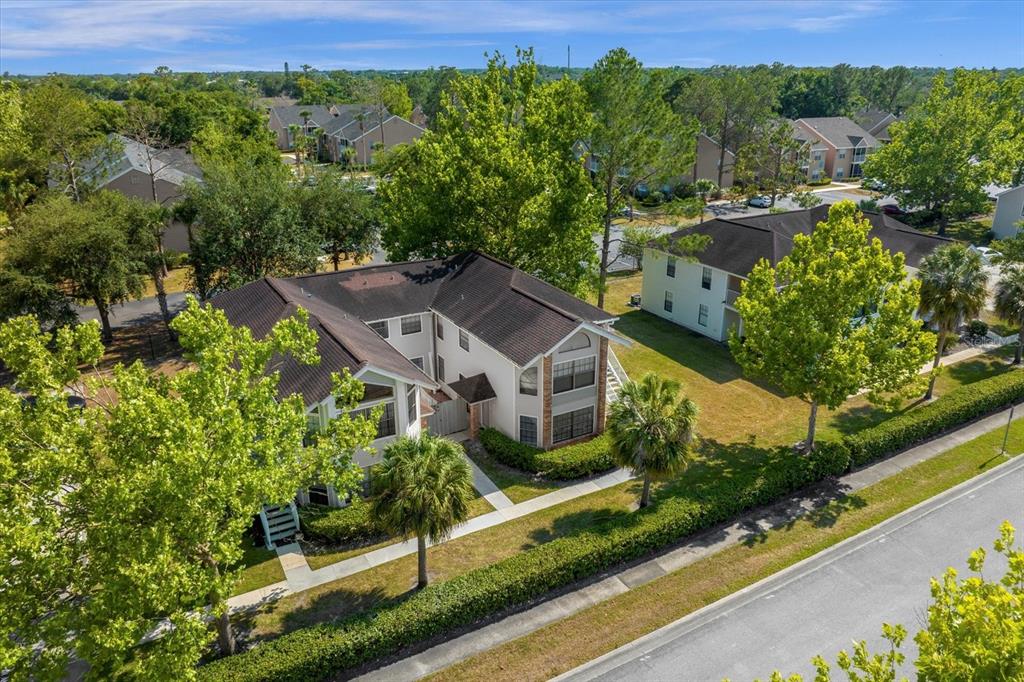 an aerial view of a house with a garden