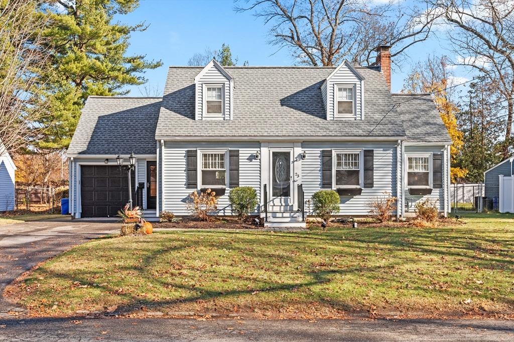 a front view of a house with outdoor seating