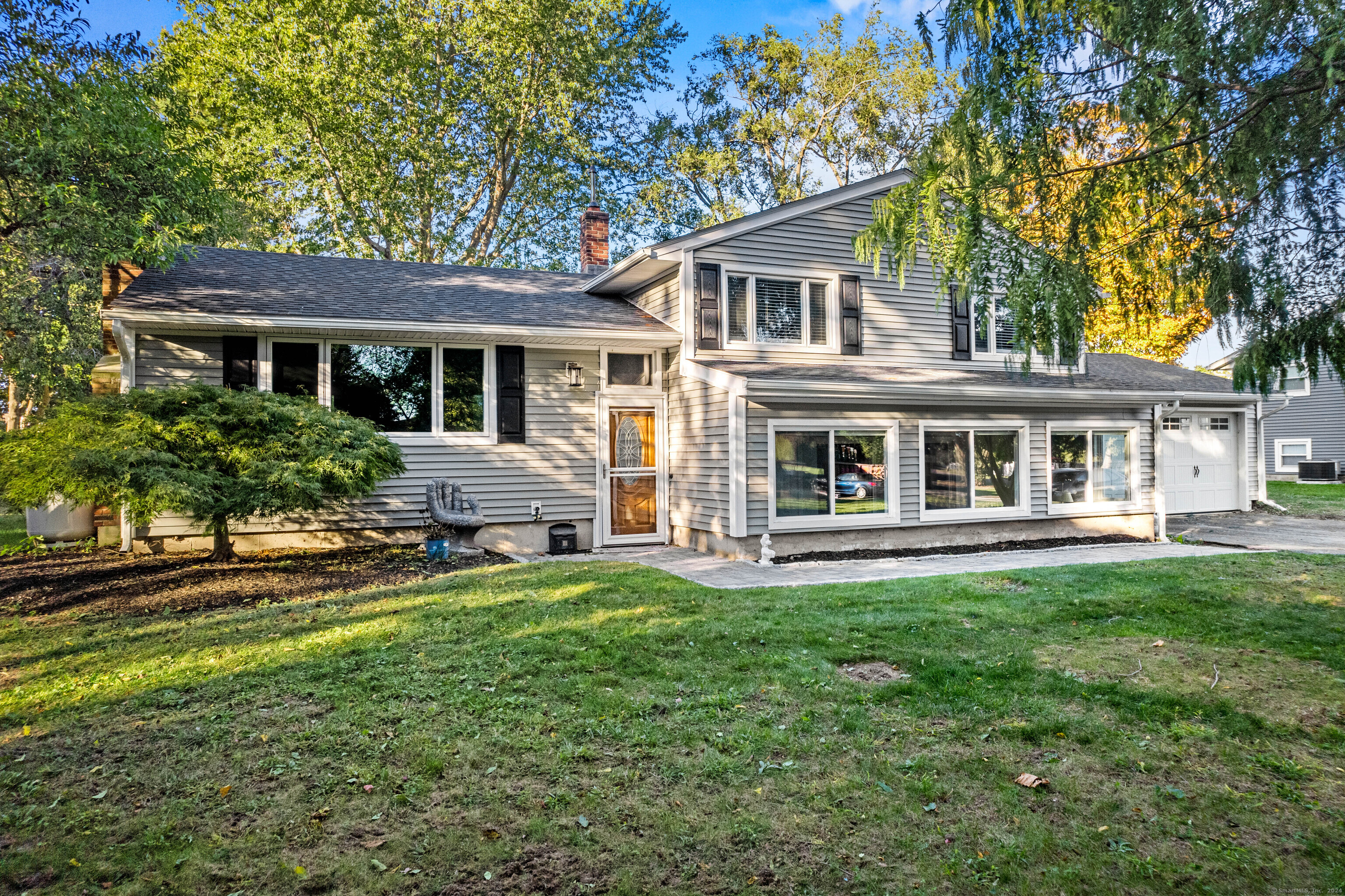 front view of a house with a yard