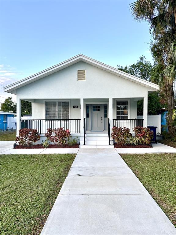 a front view of house with yard patio and green space