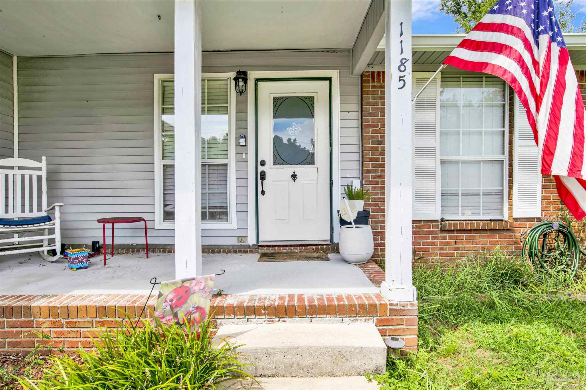 a front view of a house with a porch