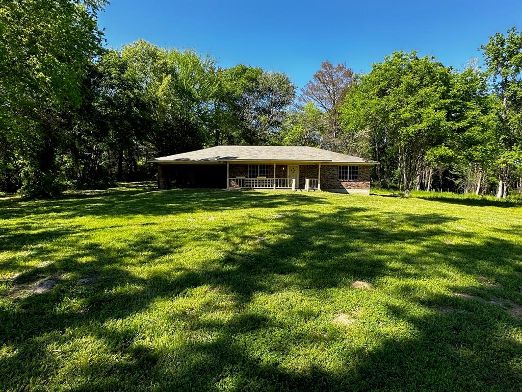 a view of a house with a big yard