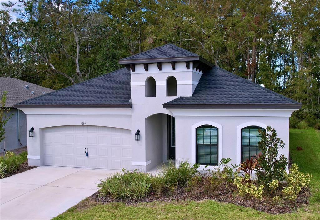 front view of a house with a yard