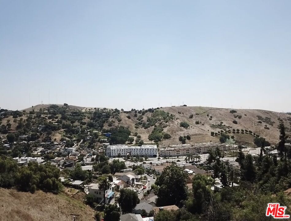 an aerial view of mountain and trees