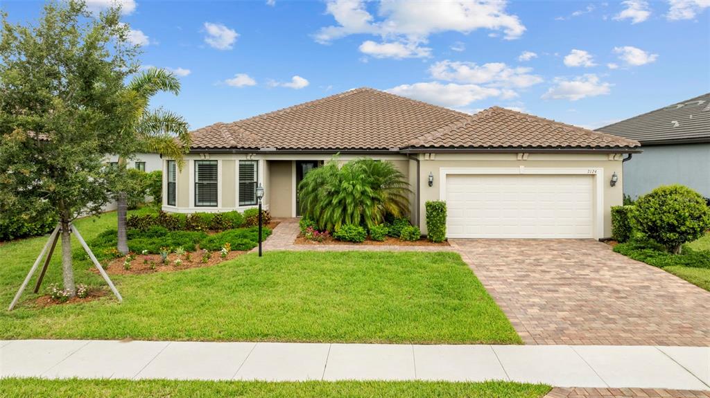 a front view of a house with a yard