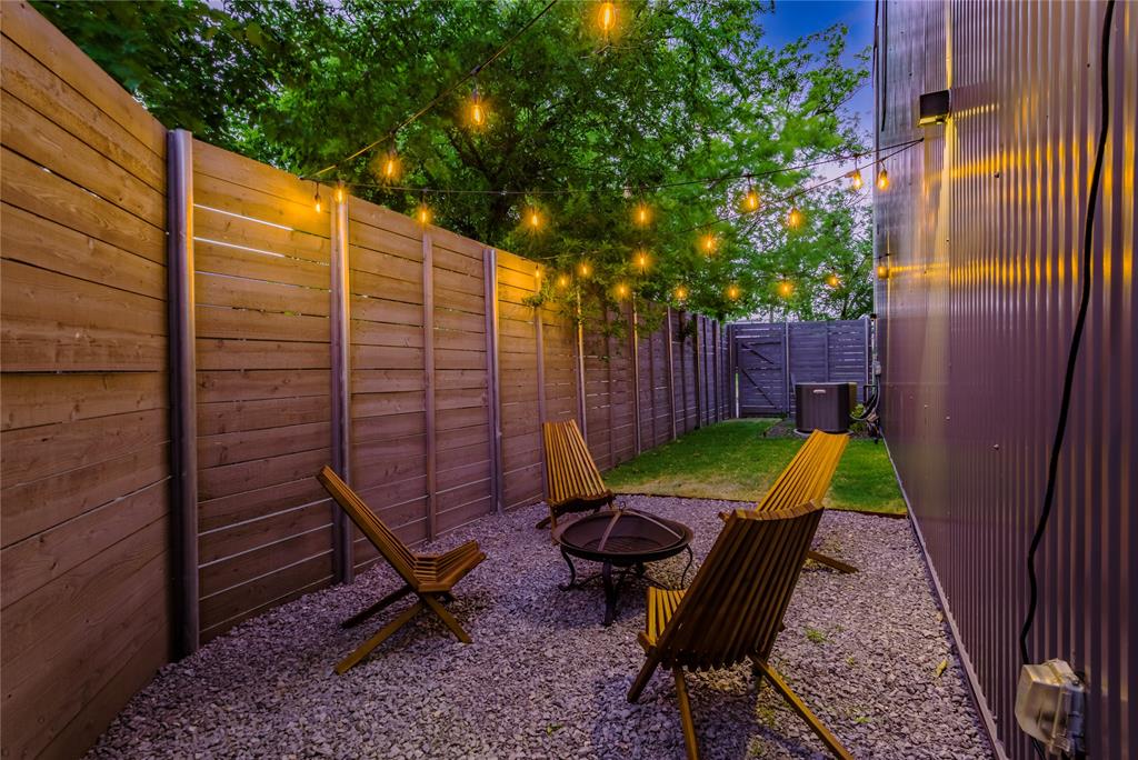 a view of a backyard with furniture and outdoor space