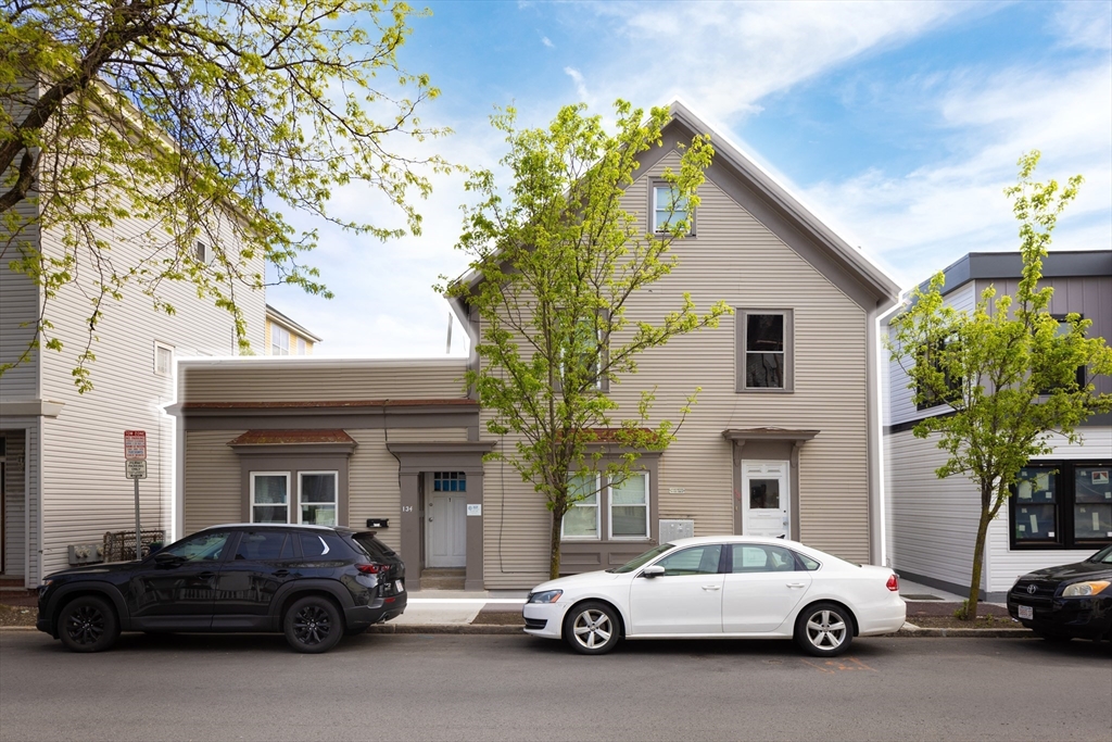 a car parked in front of a house