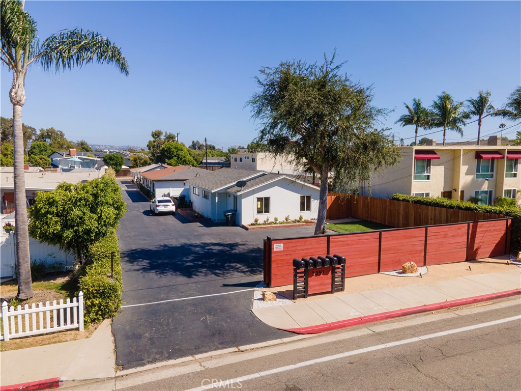 a house with palm tree in front of it