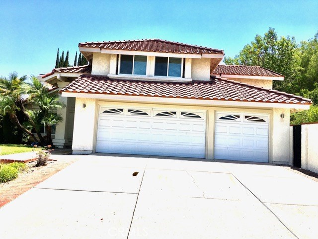 a front view of a house with a garage