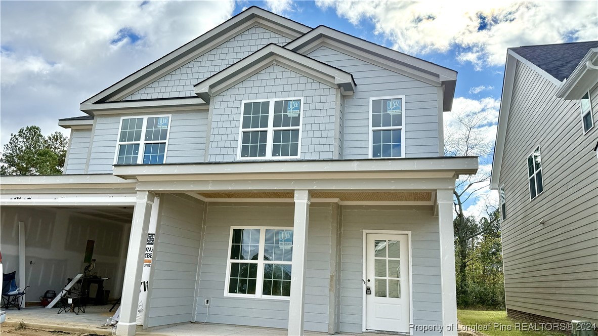 a view of a house with large windows