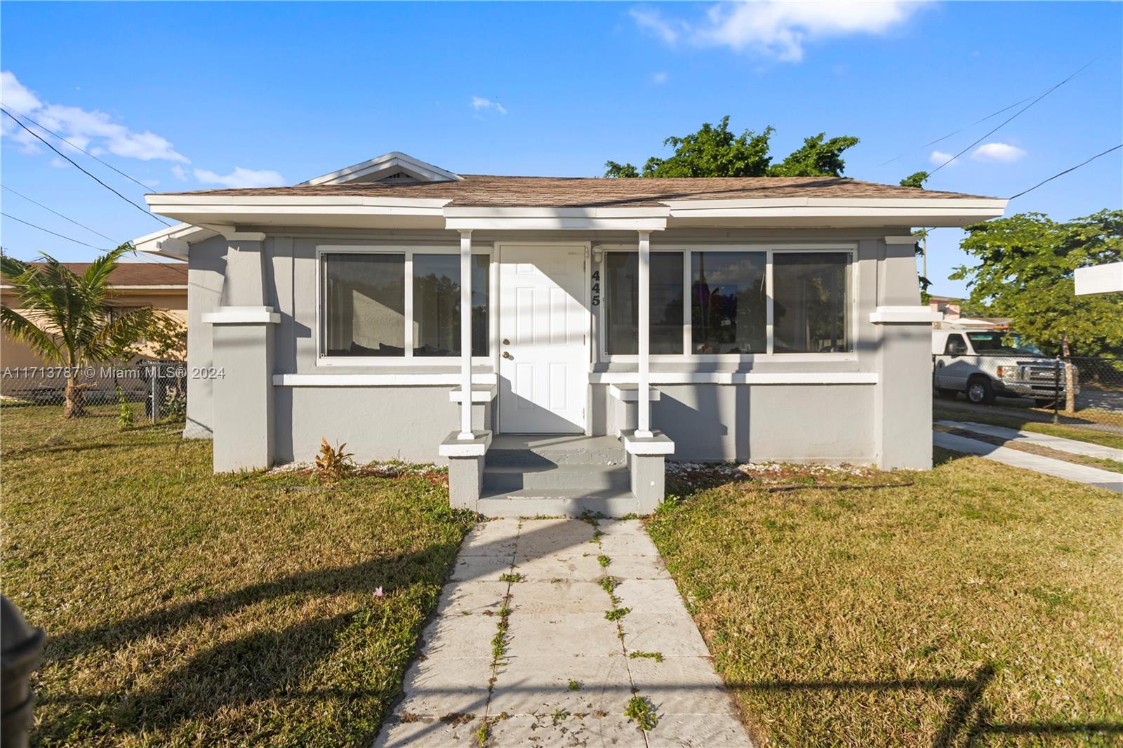 front view of a house with a yard