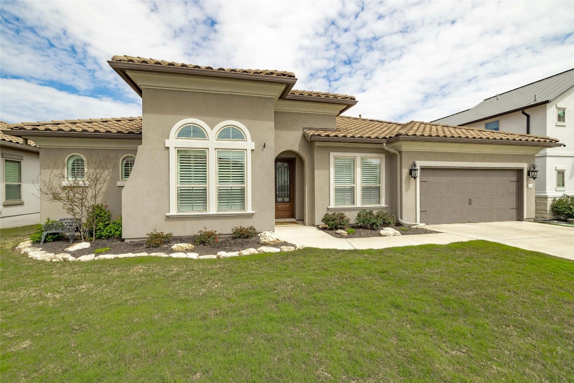 front view of a house with a yard