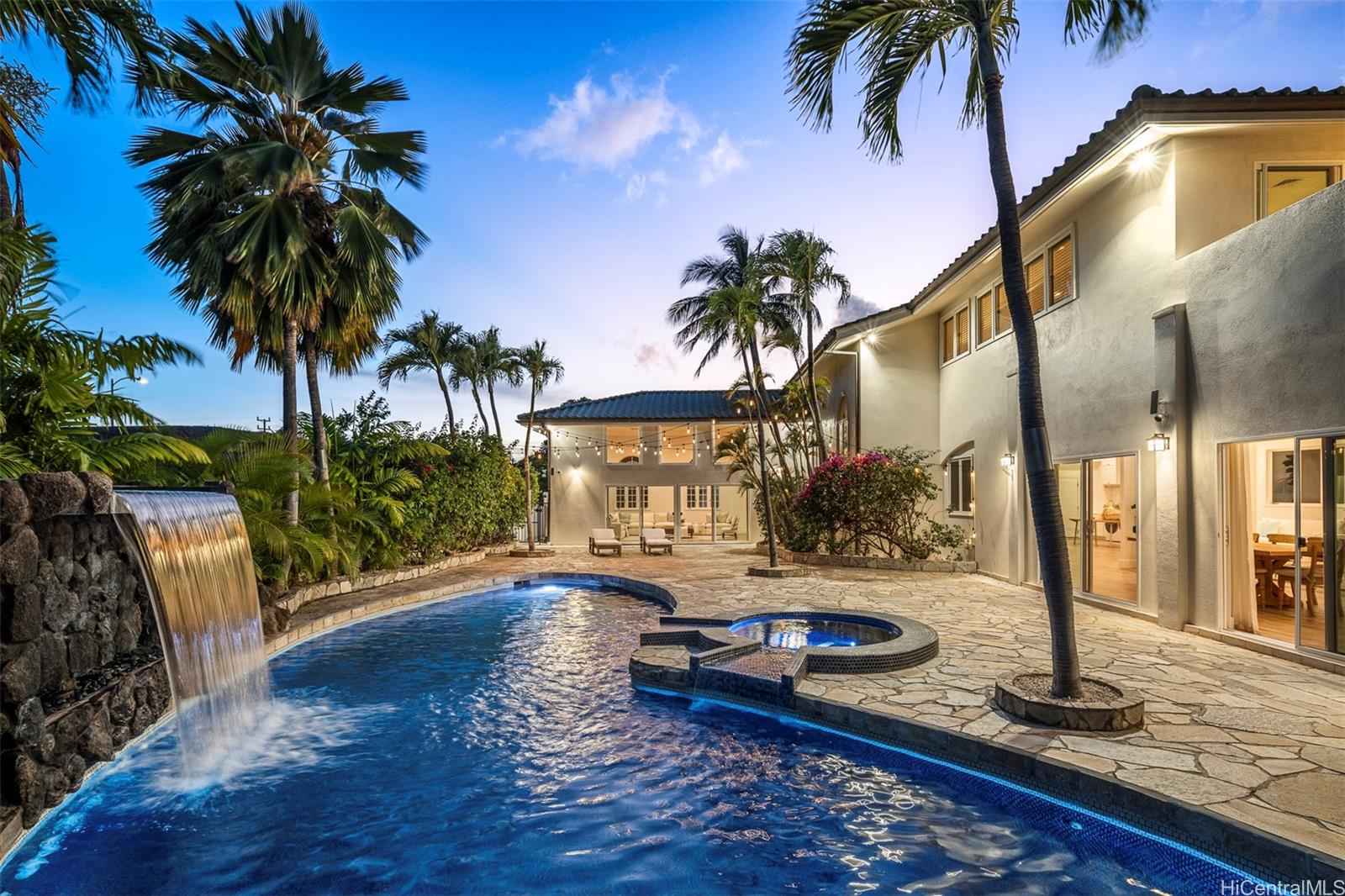 a view of a house with backyard and swimming pool