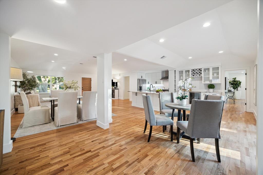 a dining room with furniture and wooden floor