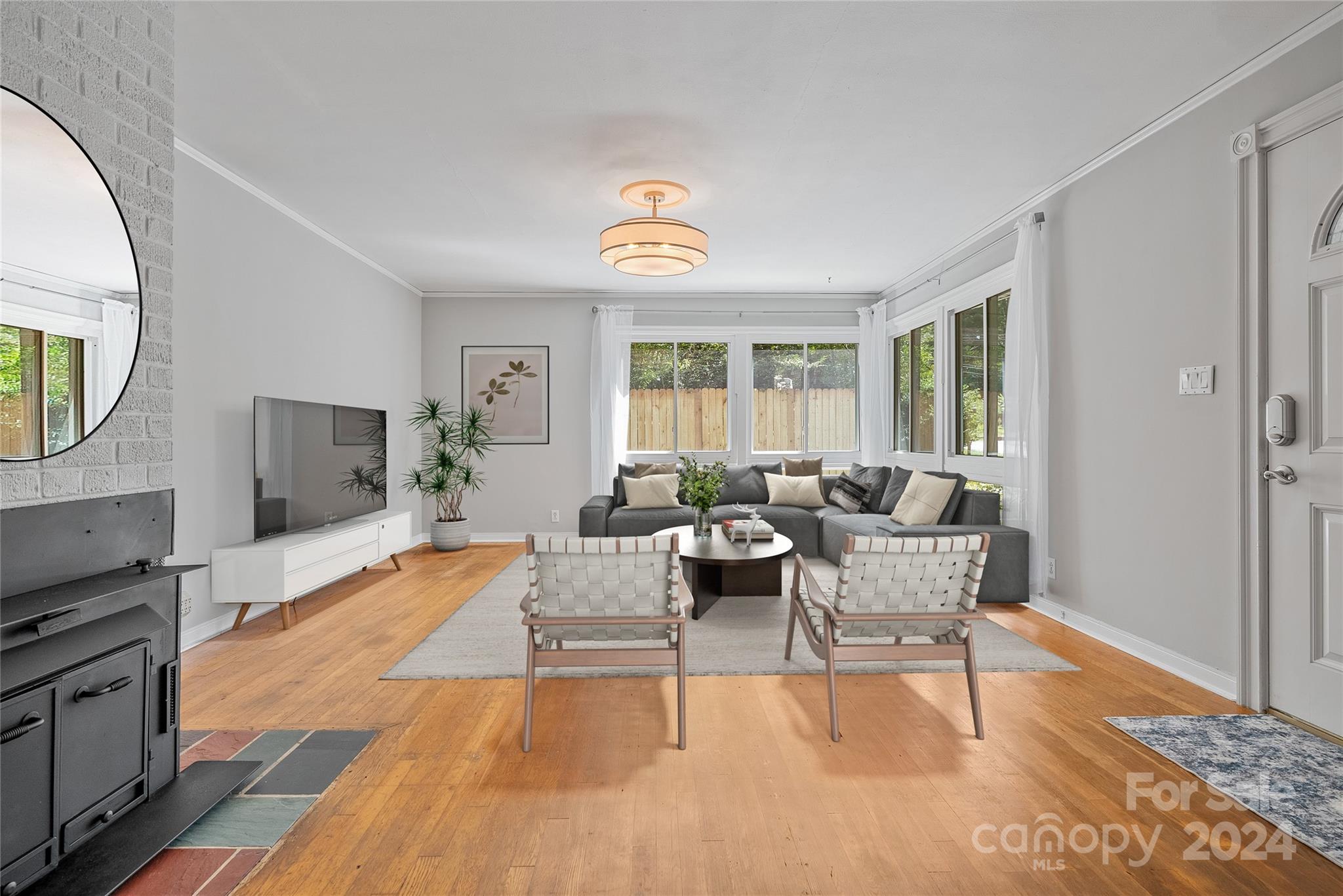 a living room with furniture and a flat screen tv