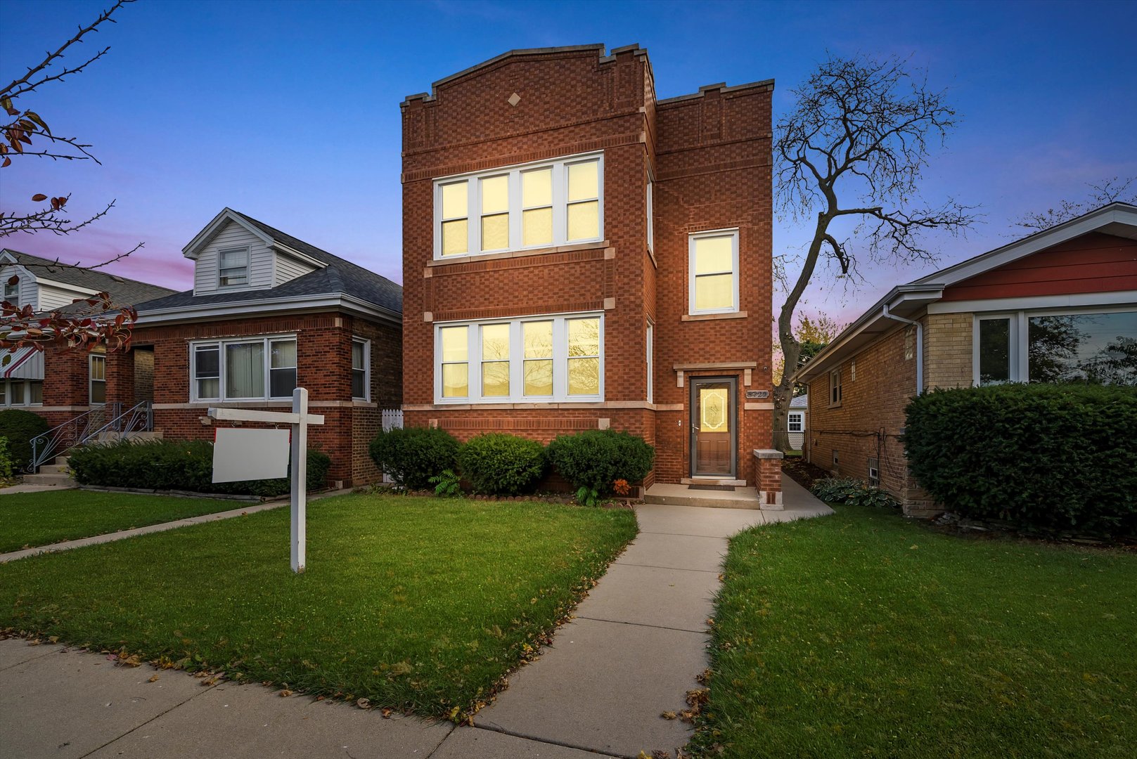 a front view of a house with a yard