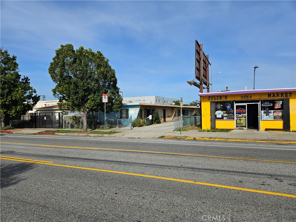 a view of a food mall next to a road