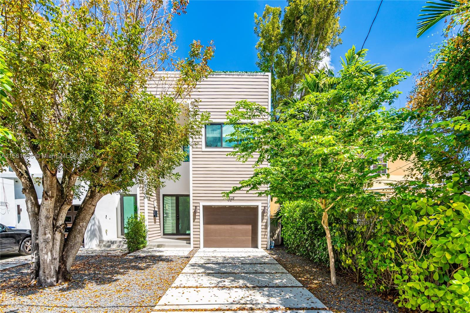 a view of a house with a tree