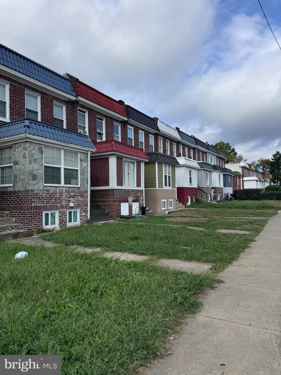 a front view of building with yard and green space