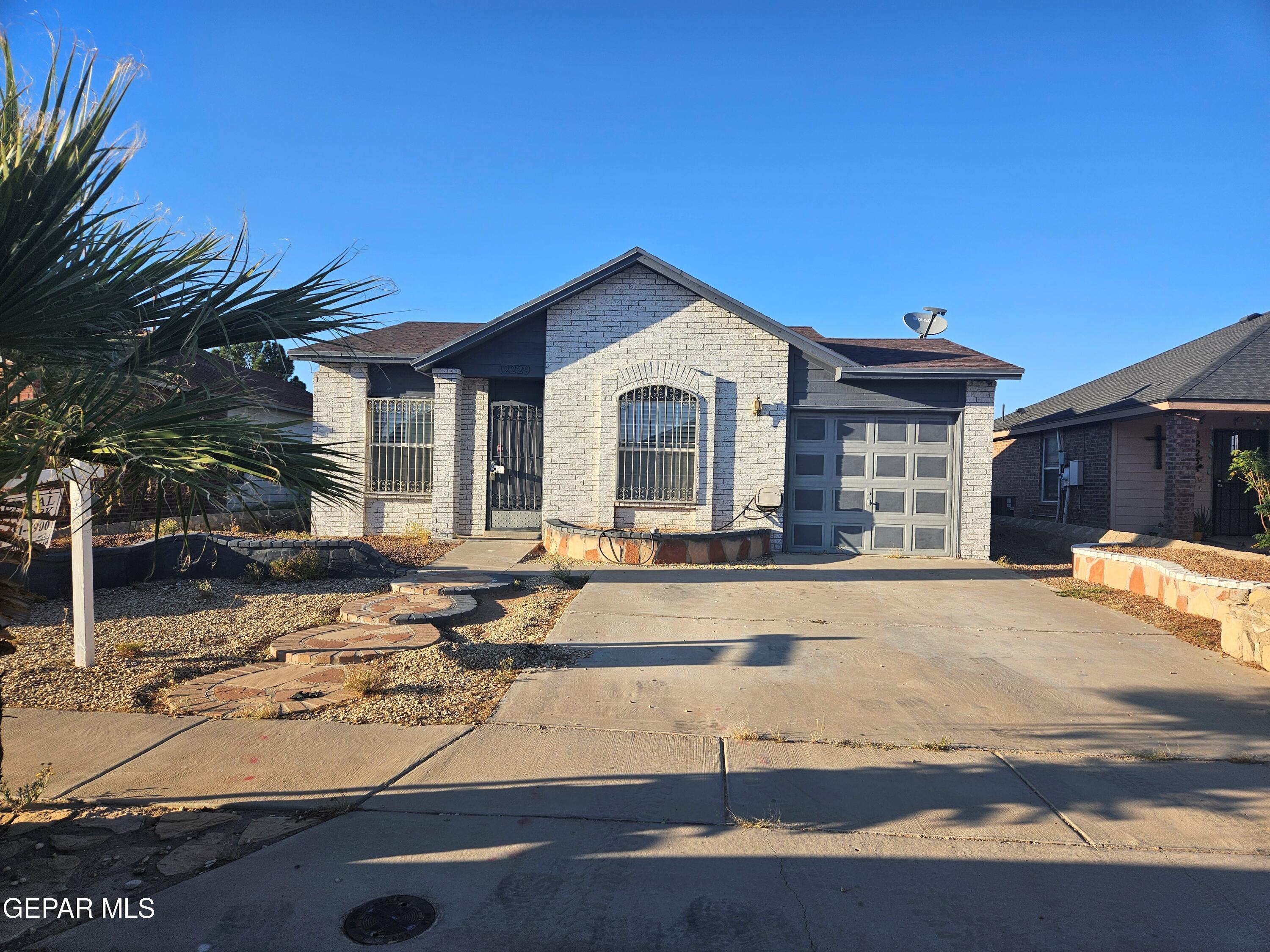 a front view of a house with yard