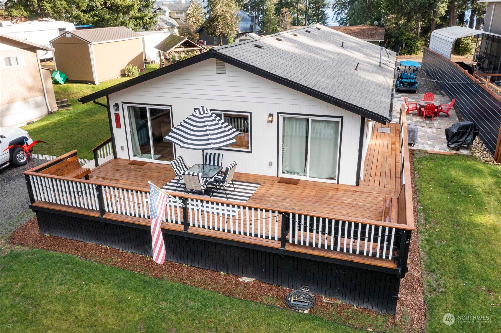 a view of a house with a wooden deck