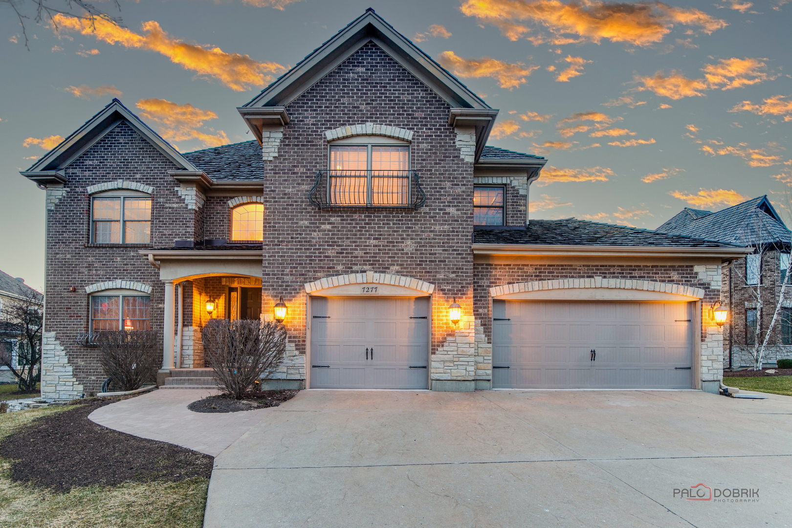 a front view of a house with parking space