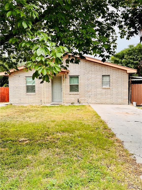 a house that has a tree in front of it