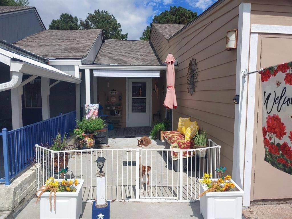 a view of house with outdoor seating and furniture