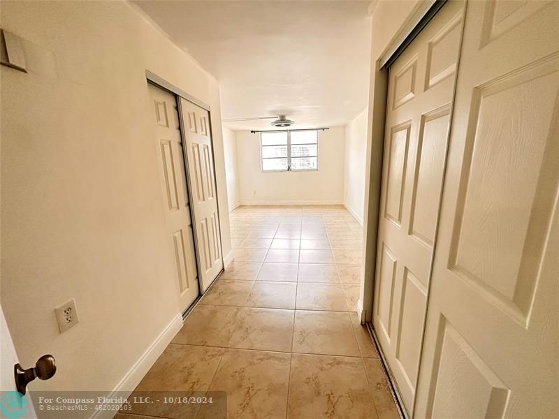 a view of hallway with windows