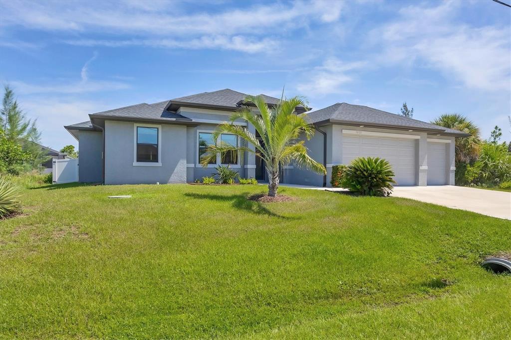 Curb view of well maintained home