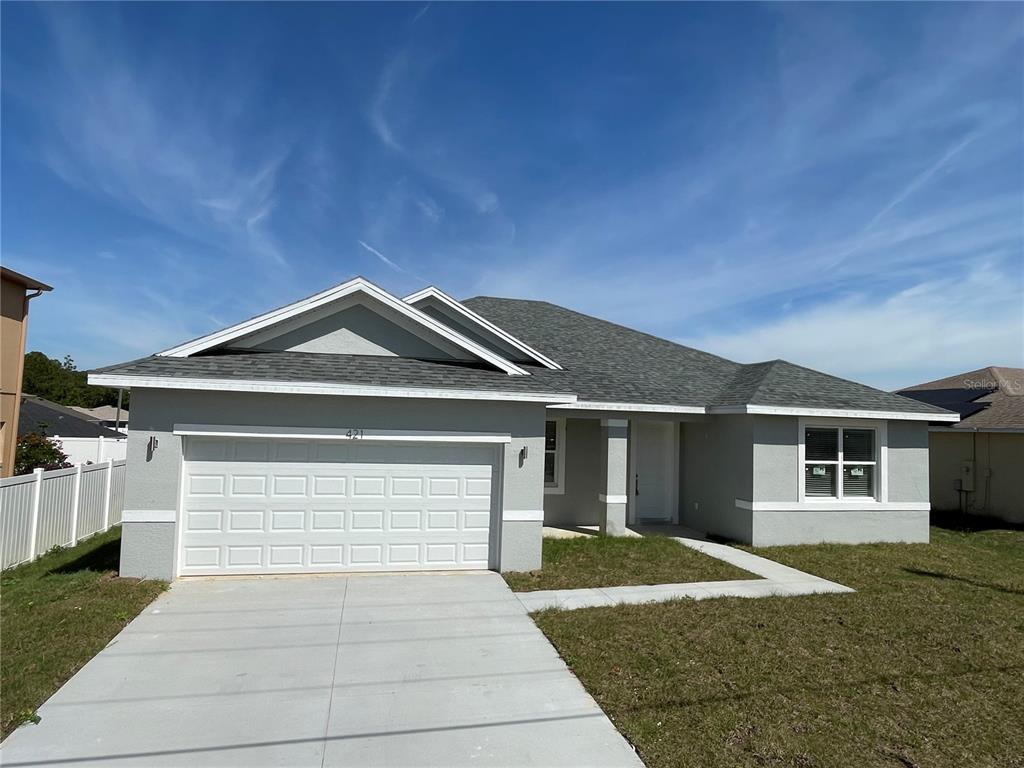 a front view of a house with yard