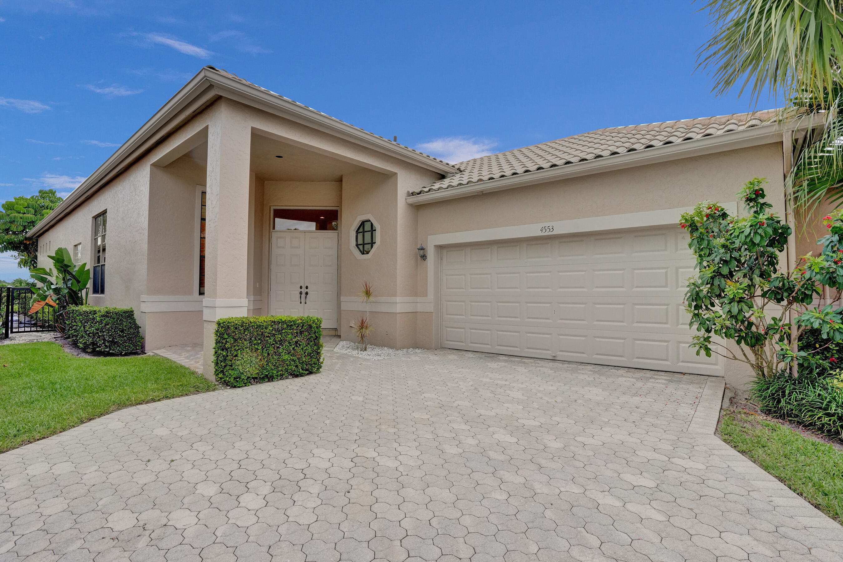 a front view of a house with a garage