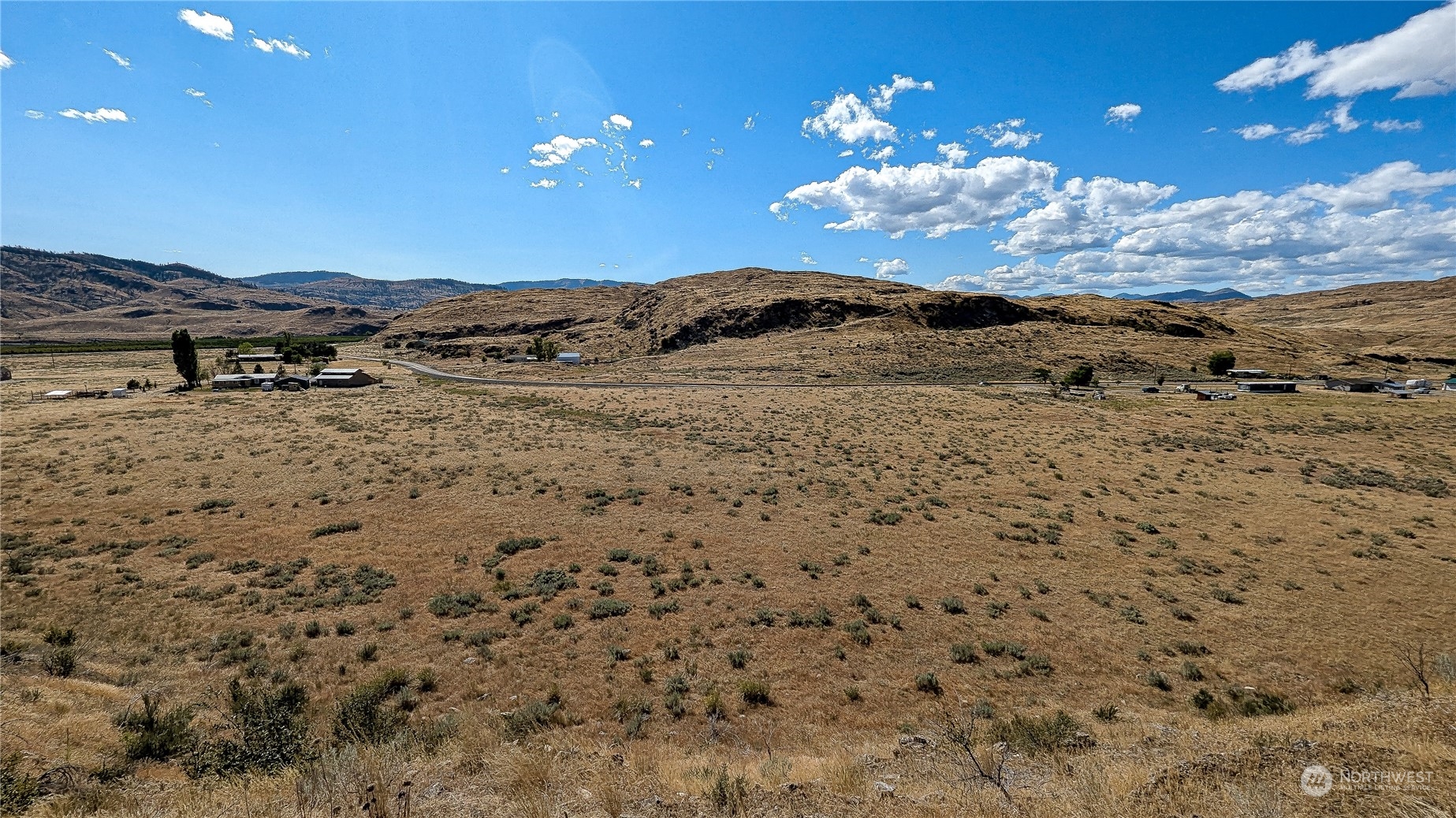 a view of a sky with mountains in the background