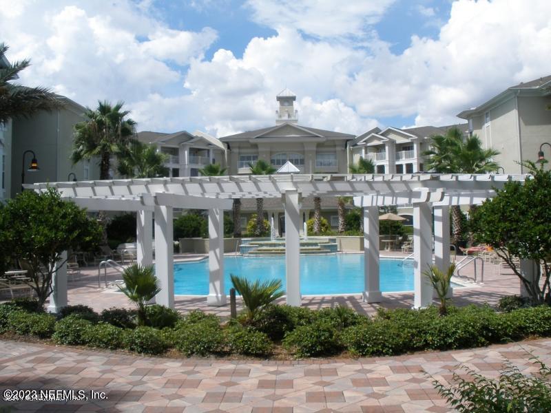 a view of a water fountain in front of house