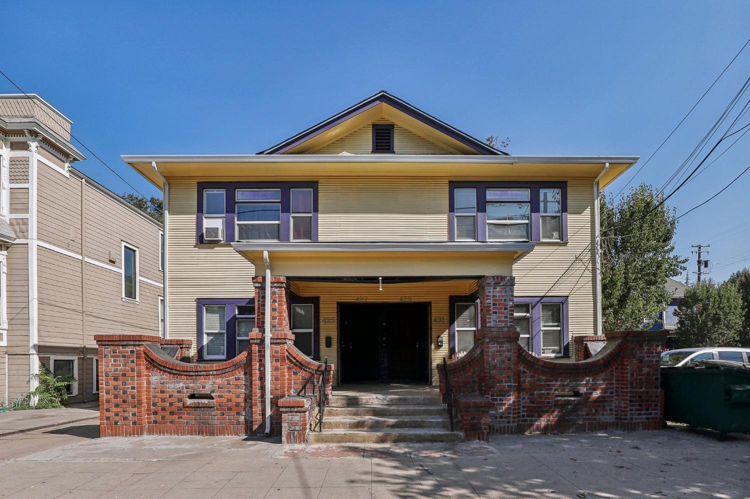 a front view of a house with a yard