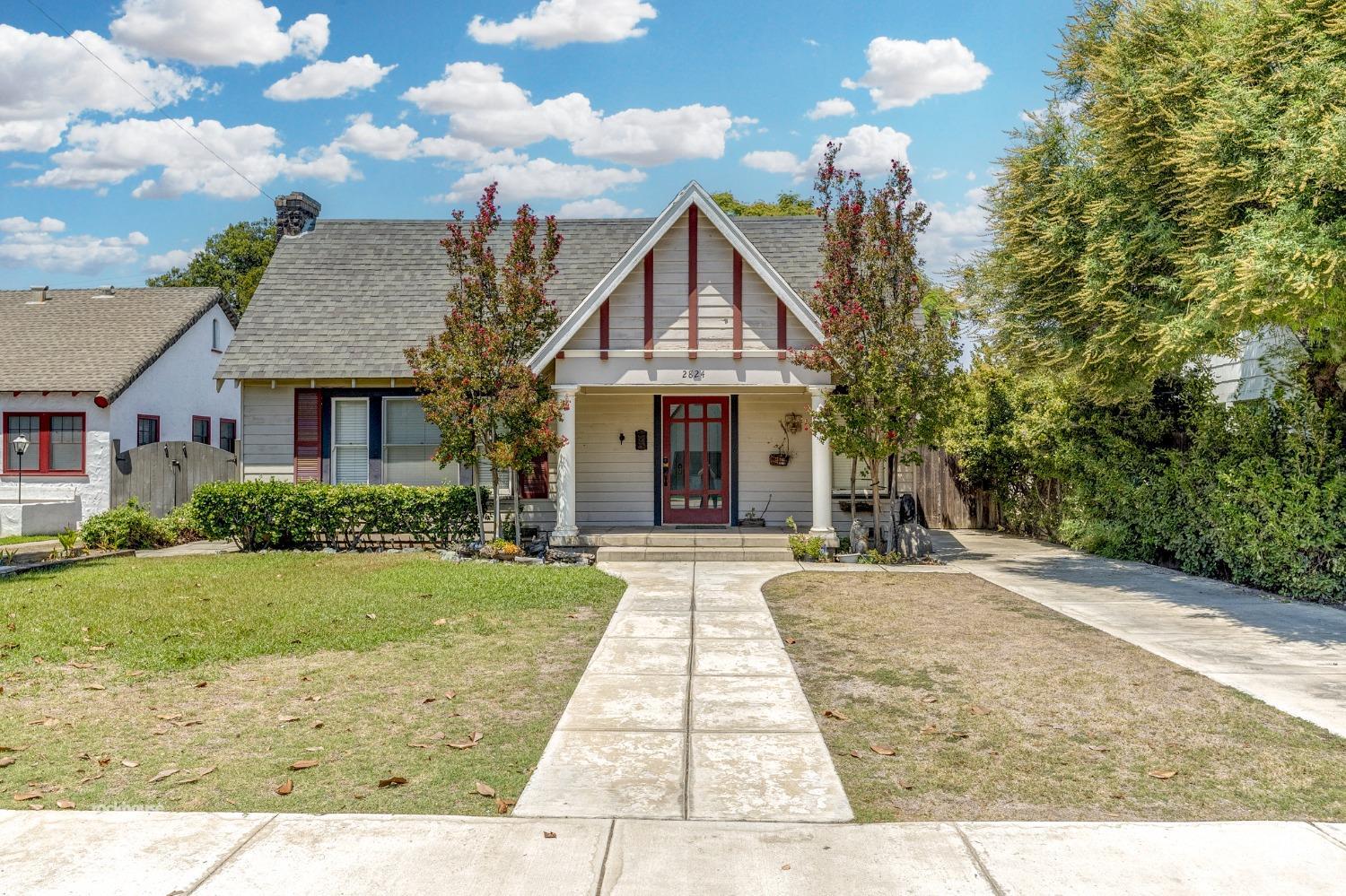 a front view of a house with yard